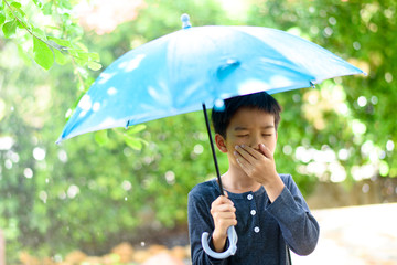 Young boy feel sick under the rain