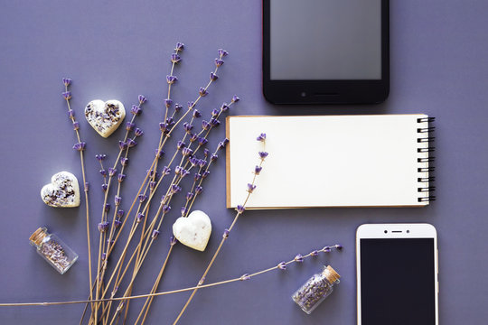 blank noteboook, gadgets and lavender flowers flatlay