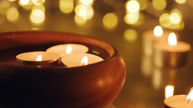 Cinemagraph - Burning candles in water.  Motion Photo.