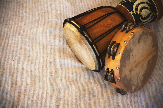 Old Wooden Djembe and Tambourine