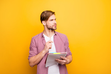 Decide think dream dreamy imagine analyze people brainstorm person concept. Portrait of pensive thoughtful handsome smart clever focused guy with copybook pen in hands isolated on bright background