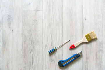 Tools for repair on light wooden background