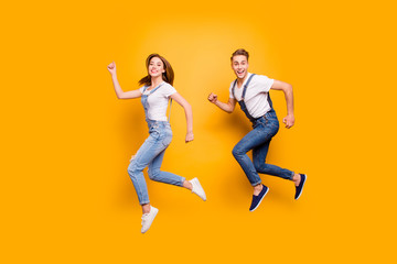 Summer dreamy student freedom fly teen age youth person concept. Side view full size length photo portrait of two cheerful rejoicing attractive handsome guy lady making movement isolated background