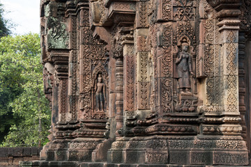 Angkor Cambodia, ornate carvings with apsaras on walls at the 10th century Banteay Srei temple