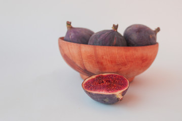 Figs in a wooden bowl. Candid.