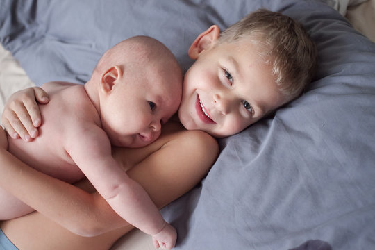 Happy Elder Brother Looks After His Newborn  One