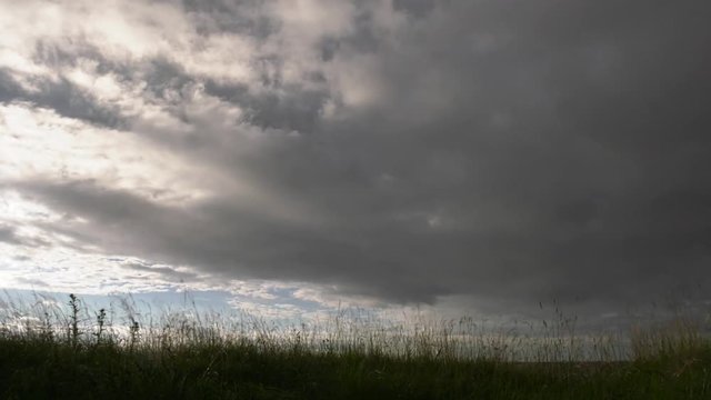 Clouds over the field. Time lapse