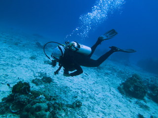 Naklejka na ściany i meble Scuba Diver, Diving, in Labuanbajo, Flores, Indonesia