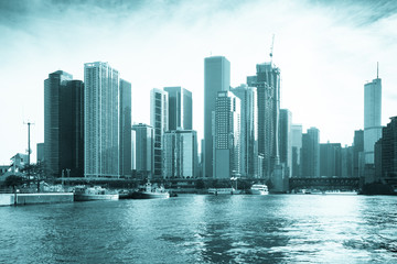 Fototapeta premium Chicago view of modern urban city skyline with office buildings and skyscrapers seen from the harbor at Lake Michigan