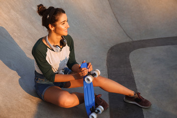 Happy cheerful woman walking outdoors © Drobot Dean
