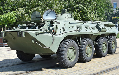 Fototapeta premium Armoured military vehicle on the street