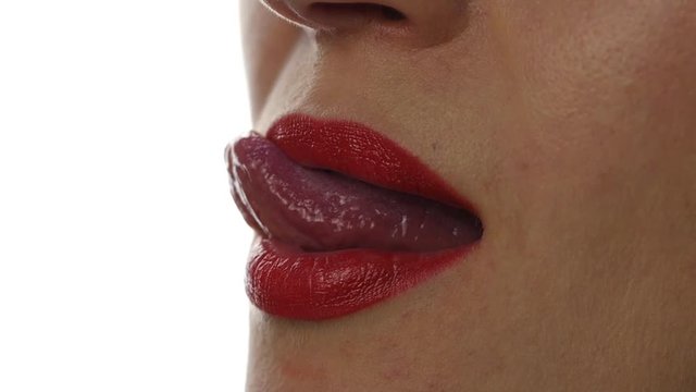 Extreme close up of sexy lip. Woman pursing her lips in a sexy seductive gesture. slow motion