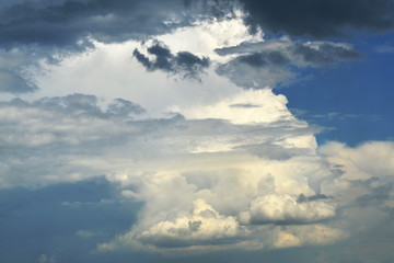 Dramatic landscape of clouds - Twin brothers in the foreground