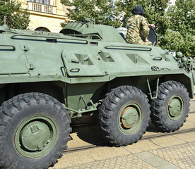 Fototapeta premium Armoured military vehicle on the street