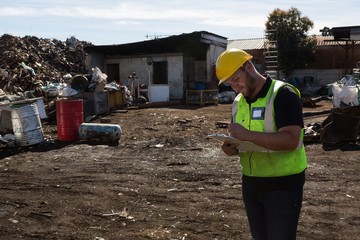 Worker writing on clipboard