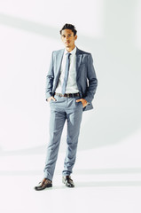 Confidence African man in suit posing in studio