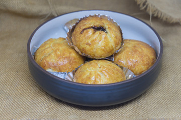 Close up fried steamed stuff bun on dish