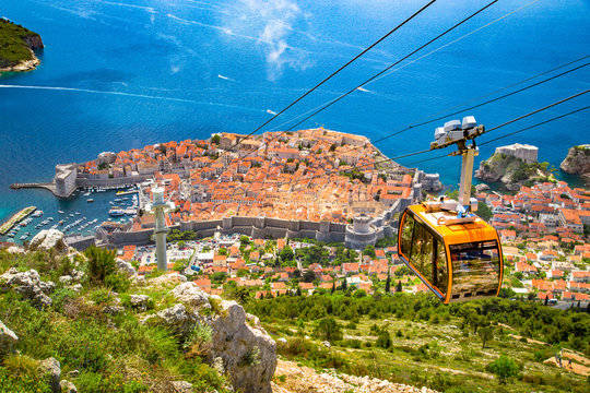 Fototapeta Old town of Dubrovnik with cable car ascending Srd mountain, Dalmatia, Croatia