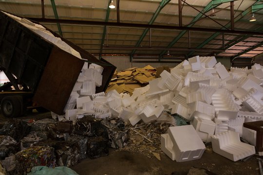 Truck emptying thermocol in the scrapyard