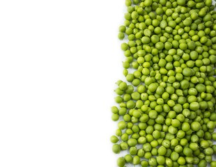 Green peas on a white background. Green peas at border of image with copy space for text. Fresh green peas on a white background.