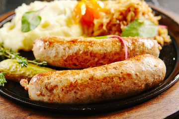 Traditional German Sausages with Mashed Potato and Sauerkraut