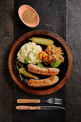 Traditional German Sausages with Mashed Potato and Sauerkraut