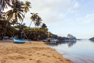  tropical landscape with traditional boats of the Philippines. Elnido, the island of Palawan.