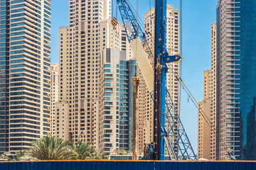 Construction in the center of the city among skyscrapers.