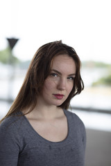 Portrait of a Pretty Woman Standing Outdoors
