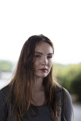 Portrait of a Pretty Woman Standing Outdoors