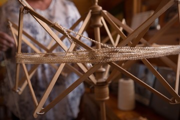 Weaving loom with silk thread at shop
