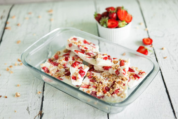 Healthy frozen yogurt barks with strawberry and granola