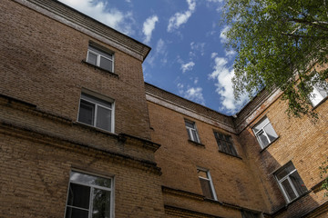 Old residential building. Apartment block. Kazakhstan (Ust-Kamenogorsk). Corner. Old architecture. Apartment building. Architectural background