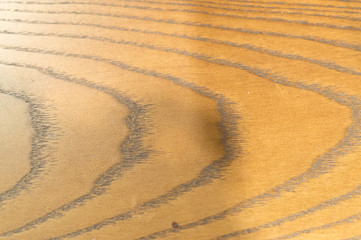 Brown wooden background with strange horizontal pattern