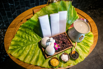 Green leaves with Natural Spa Ingredients . The herbal compress ball and ingredients for spa...