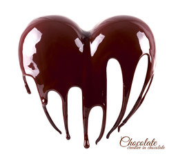 Chocolate in the form of heart. Melted chocolate syrup on white background. Liquid chocolate on a...