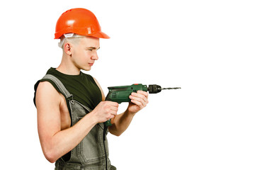 Young working guy in hard hat holds drill isolated on a white background