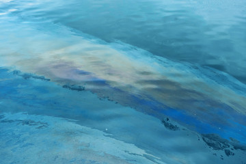 Fototapeta na wymiar oil spill in water