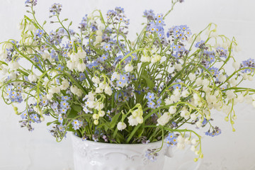 close up of forget me nots and lilies of the valley