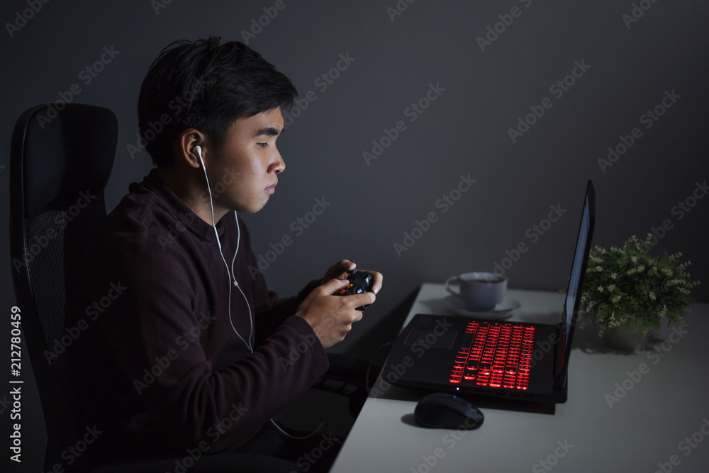 Wall mural man using joystick to playing games