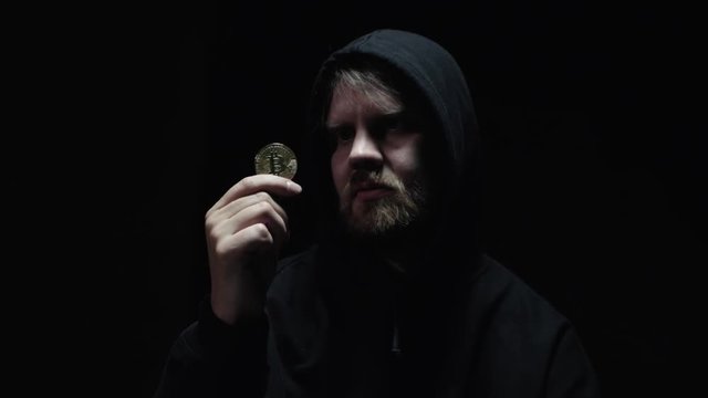A criminal getting his hands on a Bitcoin 