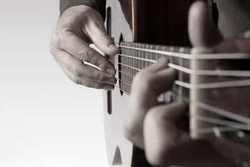 in the chord playing classical guitar closeup