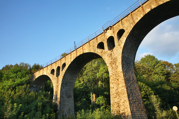 Fototapeta na wymiar Railway viaduct in Lewin Klodzki. Lower Silesian voivodeship. Poland