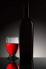 a bottle of wine with a glass
