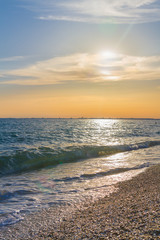 Beautiful summer sunset with clouds over the sea
