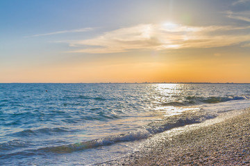 Beautiful summer sunset with clouds over the sea