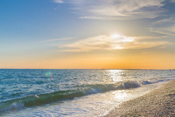Beautiful summer sunset with clouds over the sea