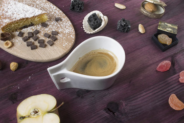 Cup of coffee with sweets and fruits