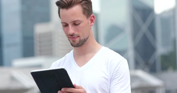 Caucasian young man use of tablet computer