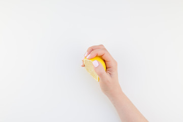 Woman hand with lemon